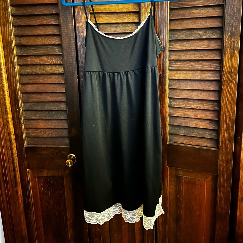 Black Sleeveless Dress with White Trim